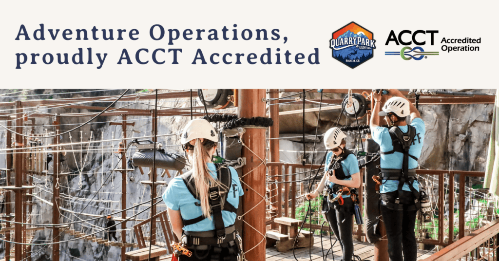 Two people with helmets and harnesses engaged in a high ropes course at Quarry Park, with an ACCT accreditation logo displayed.