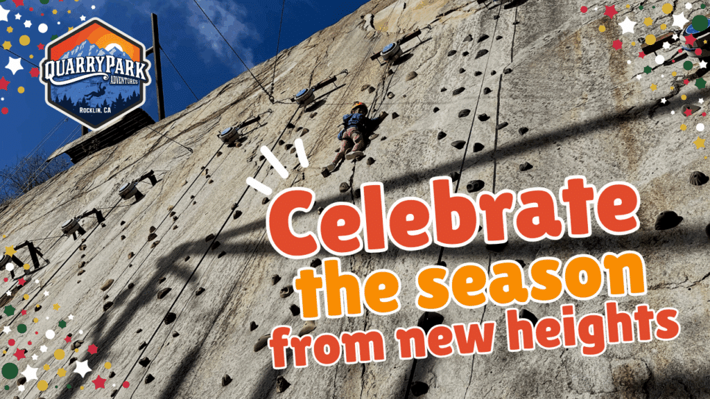 A person climbing a rock wall at the Adventure Park.