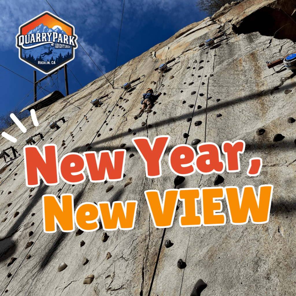 Person climbing an outdoor rock wall at Quarry Park Adventures, with large text reading "New Year, New VIEW" in the foreground—don’t miss out on our Upcoming Events for more adventure!.